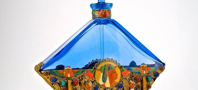 c1930 Czechoslovakian perfume bottle and stopper; blue crystal, dauber; jeweled and enameled metalwork at neck and all around. 7 1⁄2 in.
